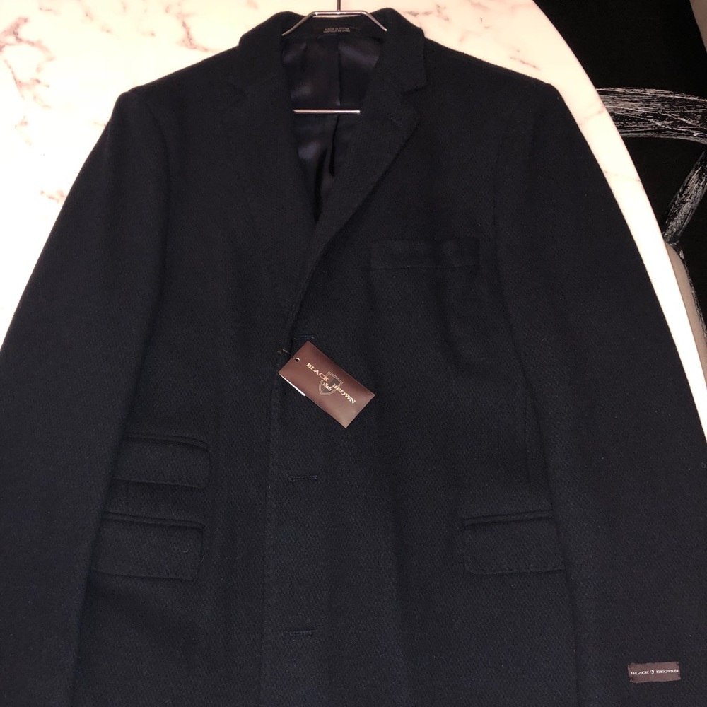 Brand New With Tags Navy wool coat. Size 46R